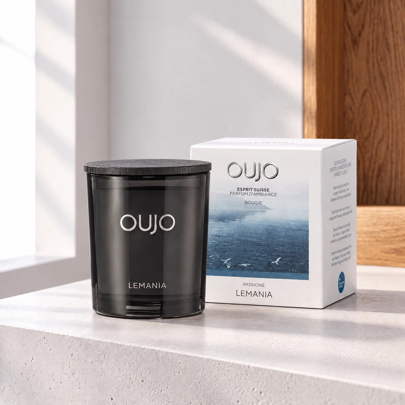 Black scented candle with wooden lid and packaging.