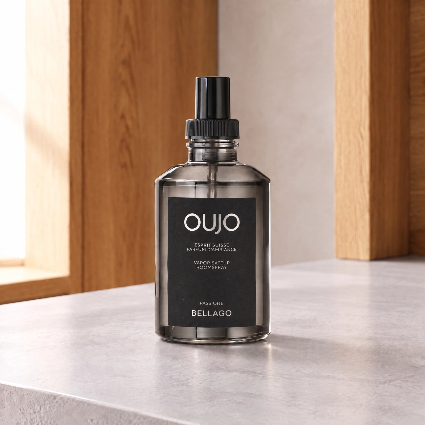An elegant Oujo room spray bottle in Bellago scent.