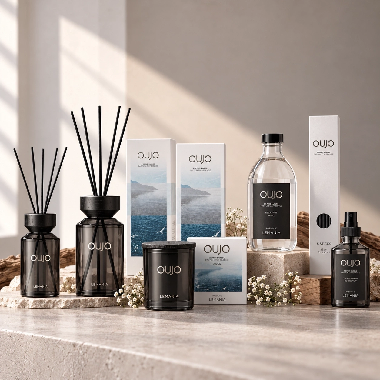 Luxurious OUJO fragrance collection featuring diffusers, candle, refill, and room spray.