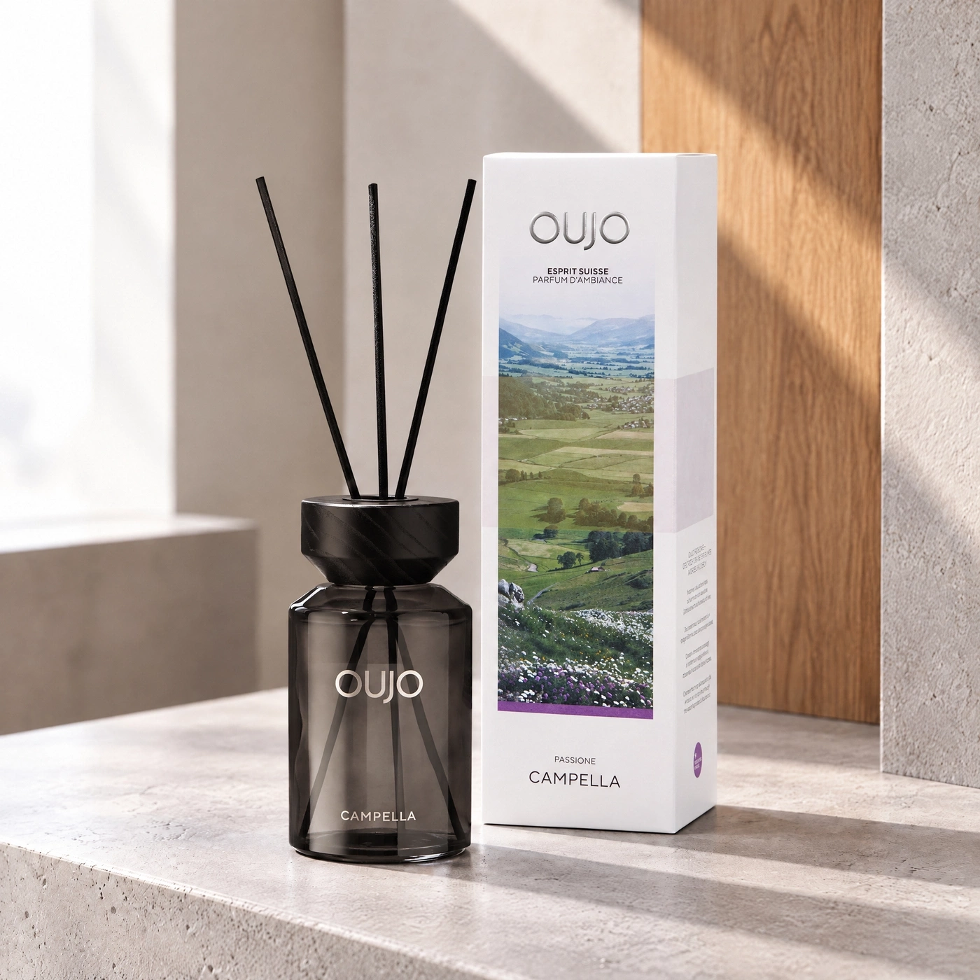 Diffuser with scent sticks and product packaging, mountain landscape