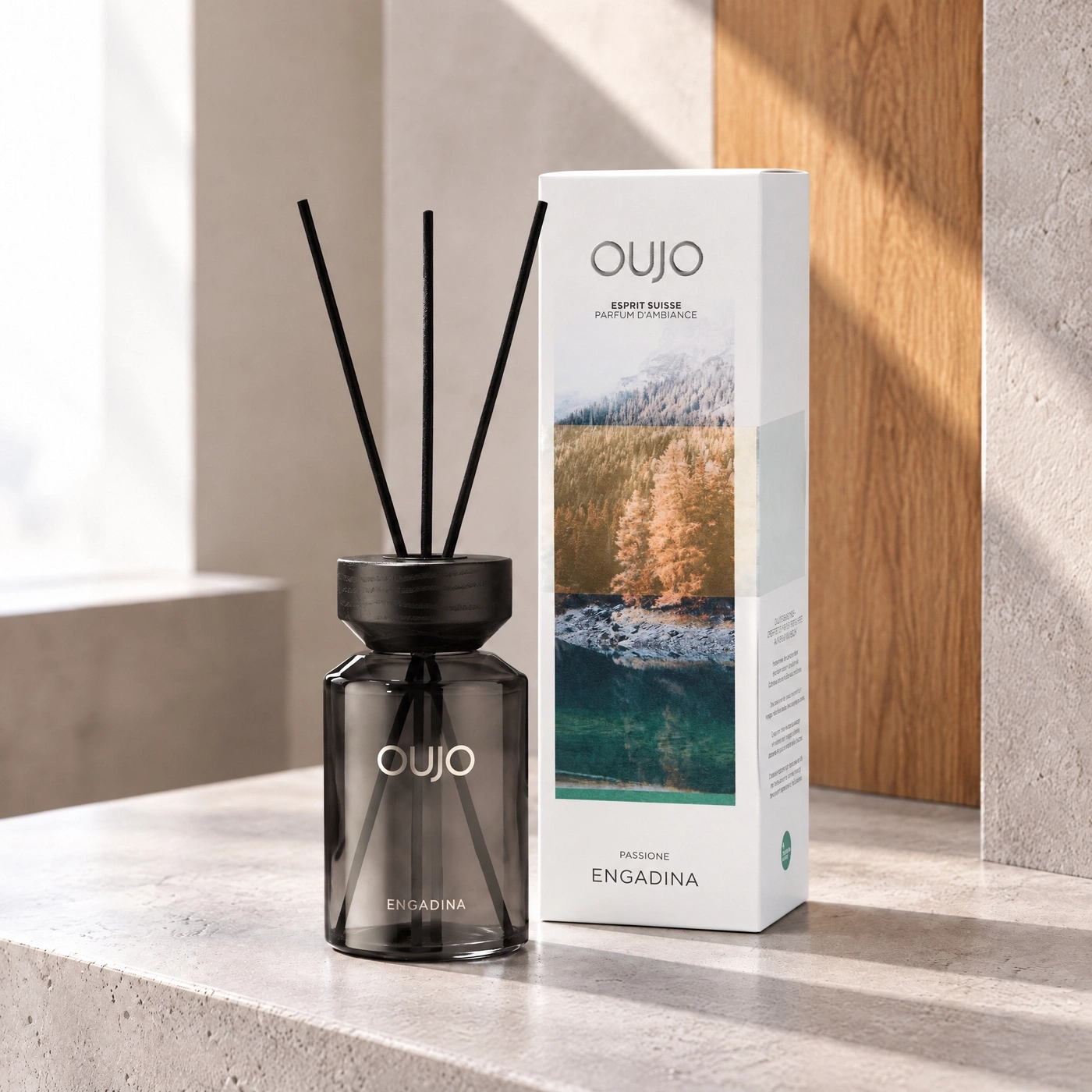 Diffuser with scent sticks and packaging with mountain landscape motif