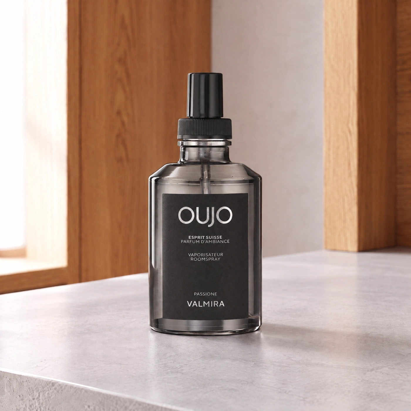 A modern room spray bottle displayed in a stylish indoor setting.