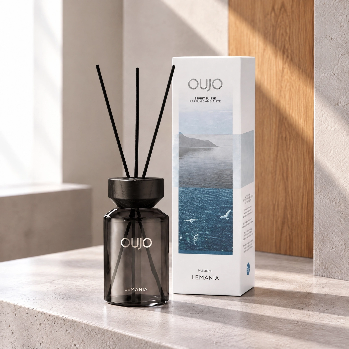 A diffuser and box featuring mountain scenes and birds.