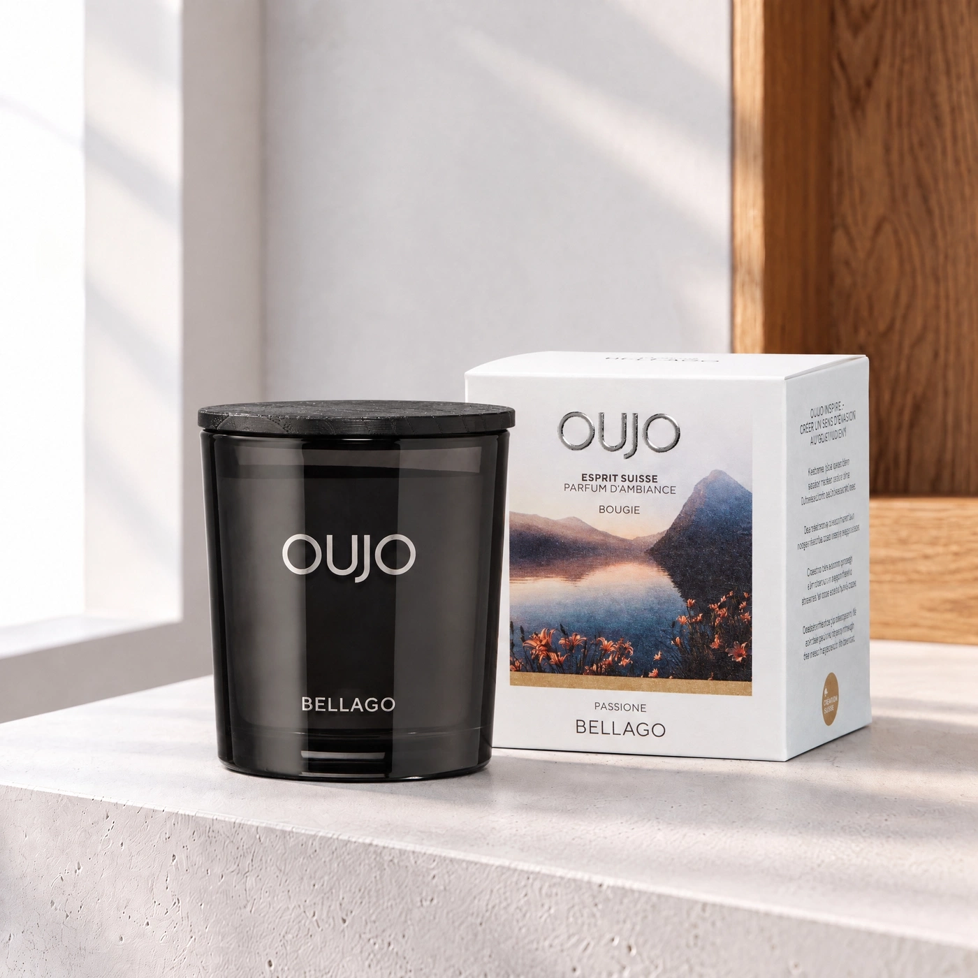 OUJO black scented candle with wooden lid and packaging, featuring a mountain and lake landscape.
