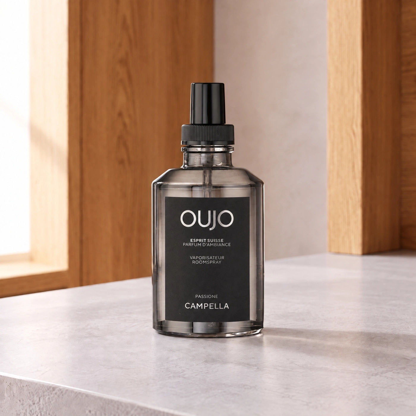 Room spray bottle with "oujo" and "Campella" branding. Luxury home fragrance.